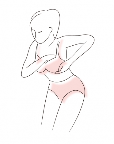 正しいブラジャーの着用法【3】／再び上体を曲げ、脇・アンダーバストの脂肪をしっかり入れ込んでから上体を起こし、整えます 
